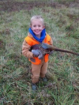 A youth helping at the pheasant hunt